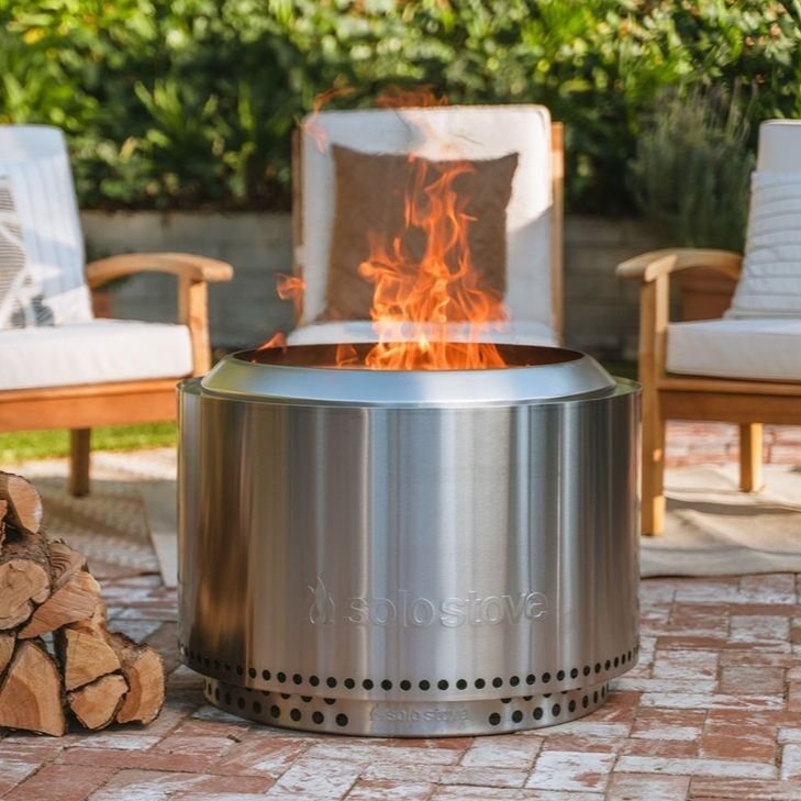 05                                    Yukon Fire Pit - More flame, less smoke. Featuring Solo Stove’s Signature 360° Airflow Design™, this sleek stainless steel wood burning fire pit will give you a smoke free, roaring fire in minutes. Its 27” size is perfect for creating a warm and cozy outdoor lounging space. SHOP NOW >