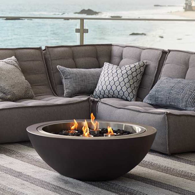 Arhaus Round Concrete Fire Pit - Simple yet stylish, this thick concrete bowl fire pit functions with either firewood or disposable gel fuel canisters. SHOP NOW >