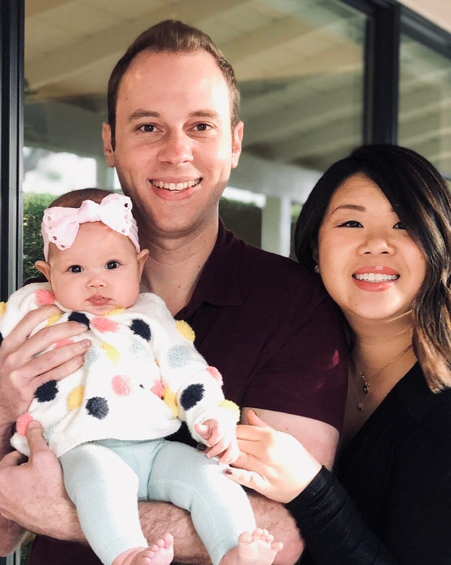 Homeowners Aaron Epstein and Lynda Chen with their young daughter.