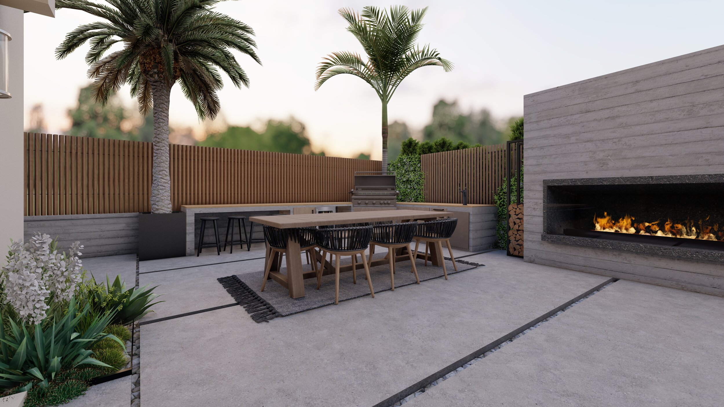 Large outdoor fireplace as the focal point of a backyard bbq and dining area
