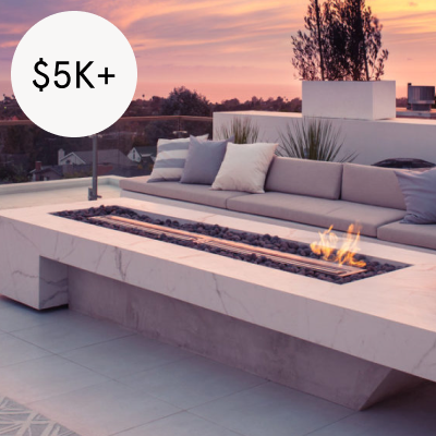BUILT-IN GAS FIRE PITS - Custom fire pit costs from $5,000 - $15,000 and vary with material choice and design complexity. The work is essentially a masonry task, but costs must also include extending gas lines to the fire pit.Image via Trendier