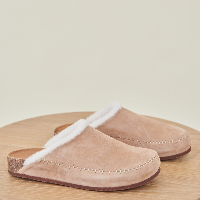 10                                   Shearling-Lined Moc Clogs - Jenni Kayne’s go-anywhere slippers are made from suede and a warm shearling lining. So, whether you’re sipping morning coffee on the porch or enjoying a casual alfresco meal, we’re betting you’ll live in these soft mocs all season. SHOP NOW >