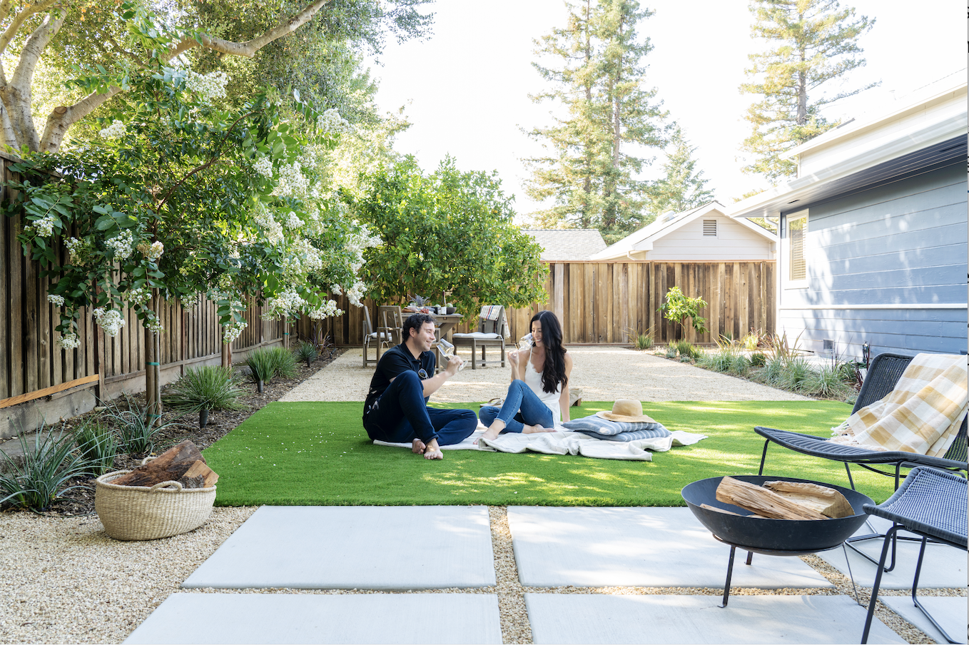 This Yardzen backyard utilizes several lawn replacements, including turf, mulch, gravel, and pavers.
