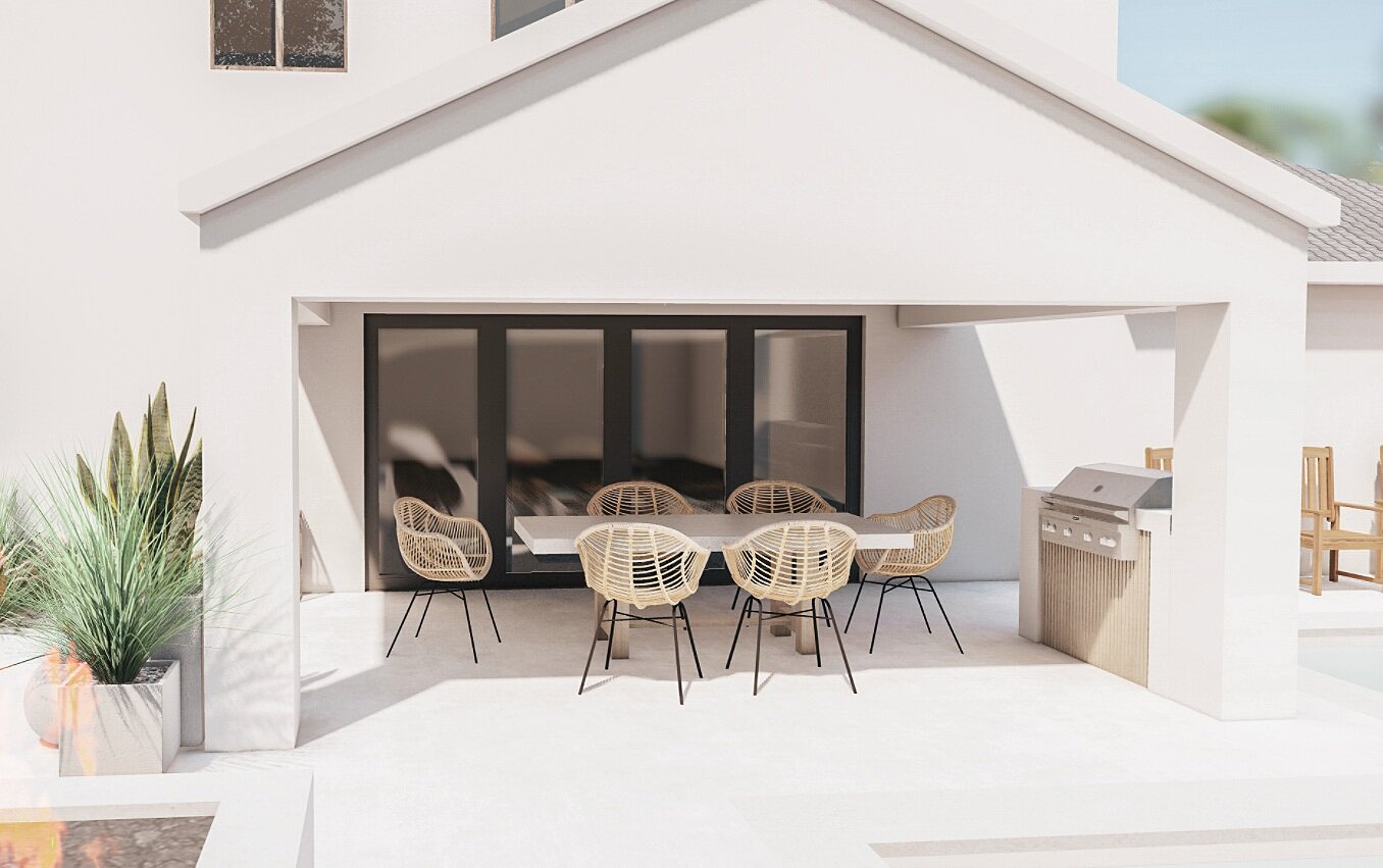 A small built-in grill with a few feet of counterspace edging a covered outdoor dining area.