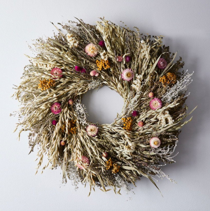 12                            Spring Prairie Wreath - Spotlight spring’s bounty of dried blossoms, herbs, and grains on your front door. Handwoven and gathered from a family farm, Creekside Farm’s wreath will usher in the new season with wafts of sweet-smelling savory and bear grass every time you walk through the door.SHOP NOW >