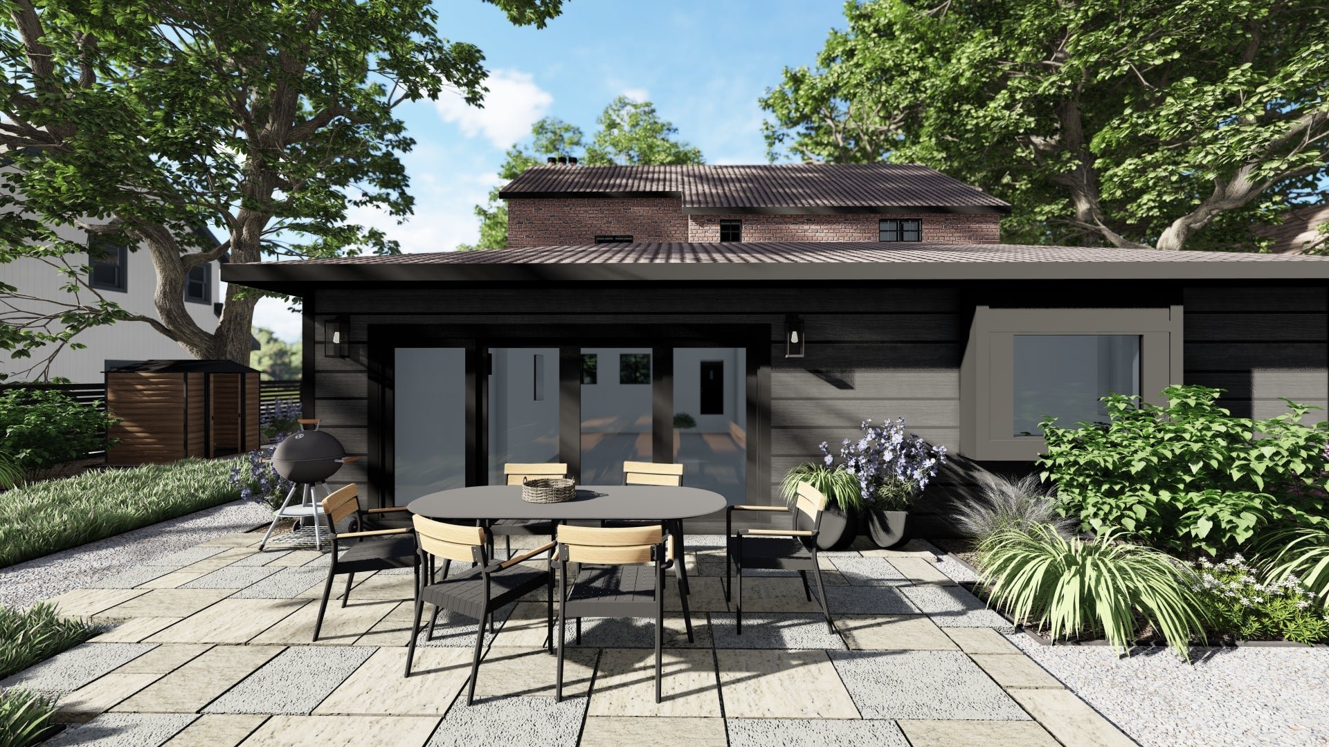 This contemporary backyard landscape design for our client in Minneapolis, MN is given an edge with black patio furniture including the Ballo dining table and a saturated black home exterior.