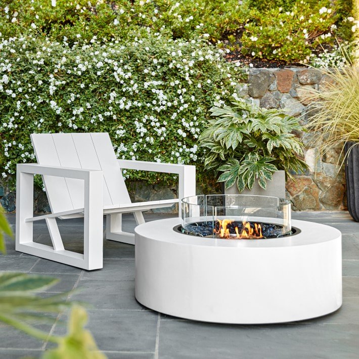 Williams Sonoma Home’s EcoSmart Fire Table Ark 40 - Masterfully crafted from composite concrete, the Ark 40 operates with three fuel-type options: plumbed natural gas and liquid propane for outdoor use, or eco-friendly bioethanol for indoor/outdoor use. The round fire table yields a clean-burning flame and ample surface space for holding glassware and appetizers, the modern fire table creates an inviting space for relaxation.SHOP NOW >MORE MODERN FIRE PITS >