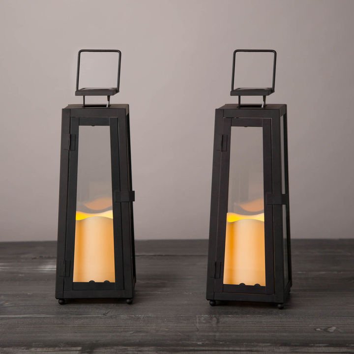 09                                   Quincy Solar Lanterns - You won’t regret adding these no-fuss black hurricanes to your list of must-haves this fall. Crafted of glass and metal, these sleek handled lanterns come with solar-powered flameless candles which, on a full charge, keep lit for up to eight hours.SHOP NOW >