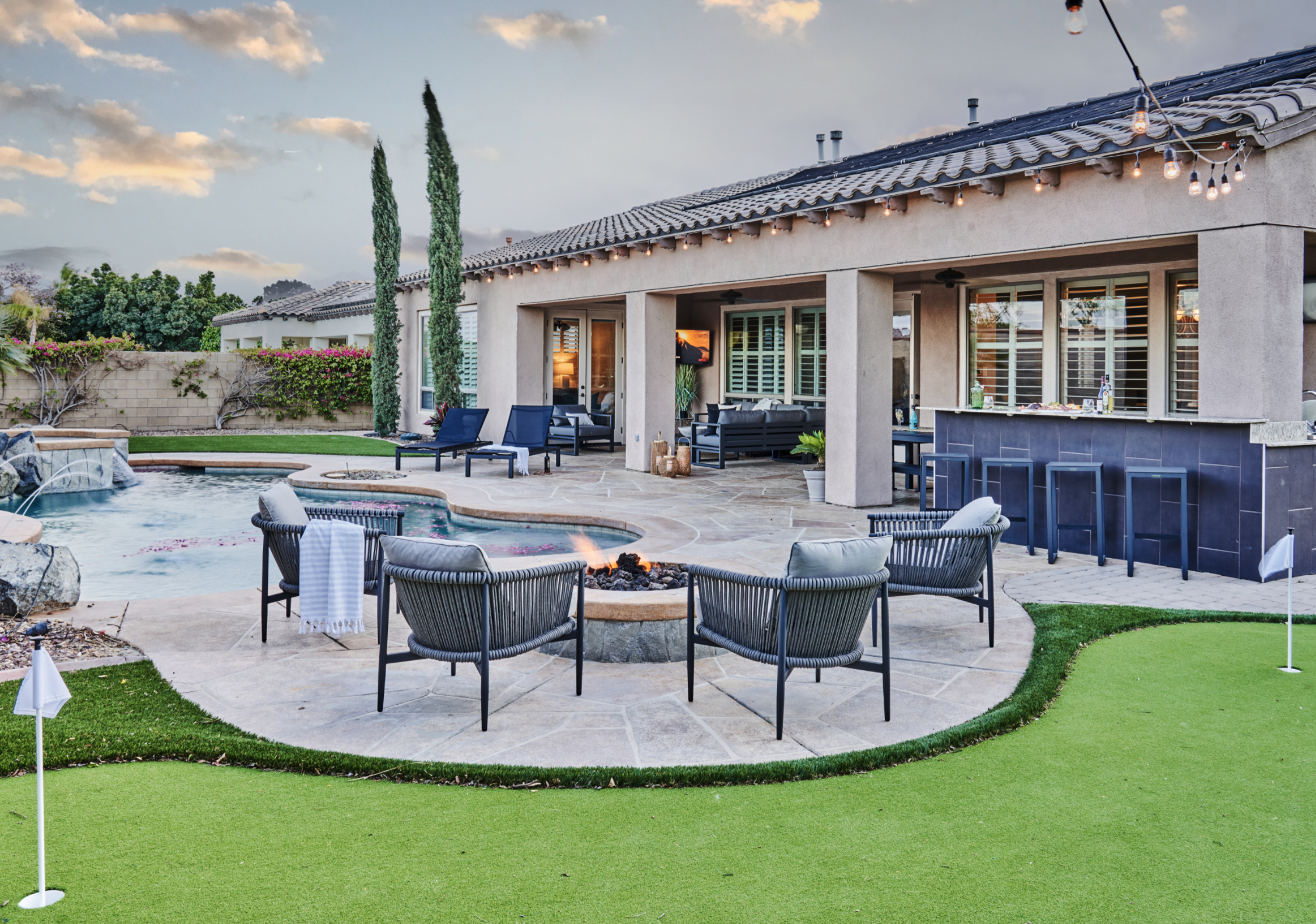 Country club-like backyard with fire pit area