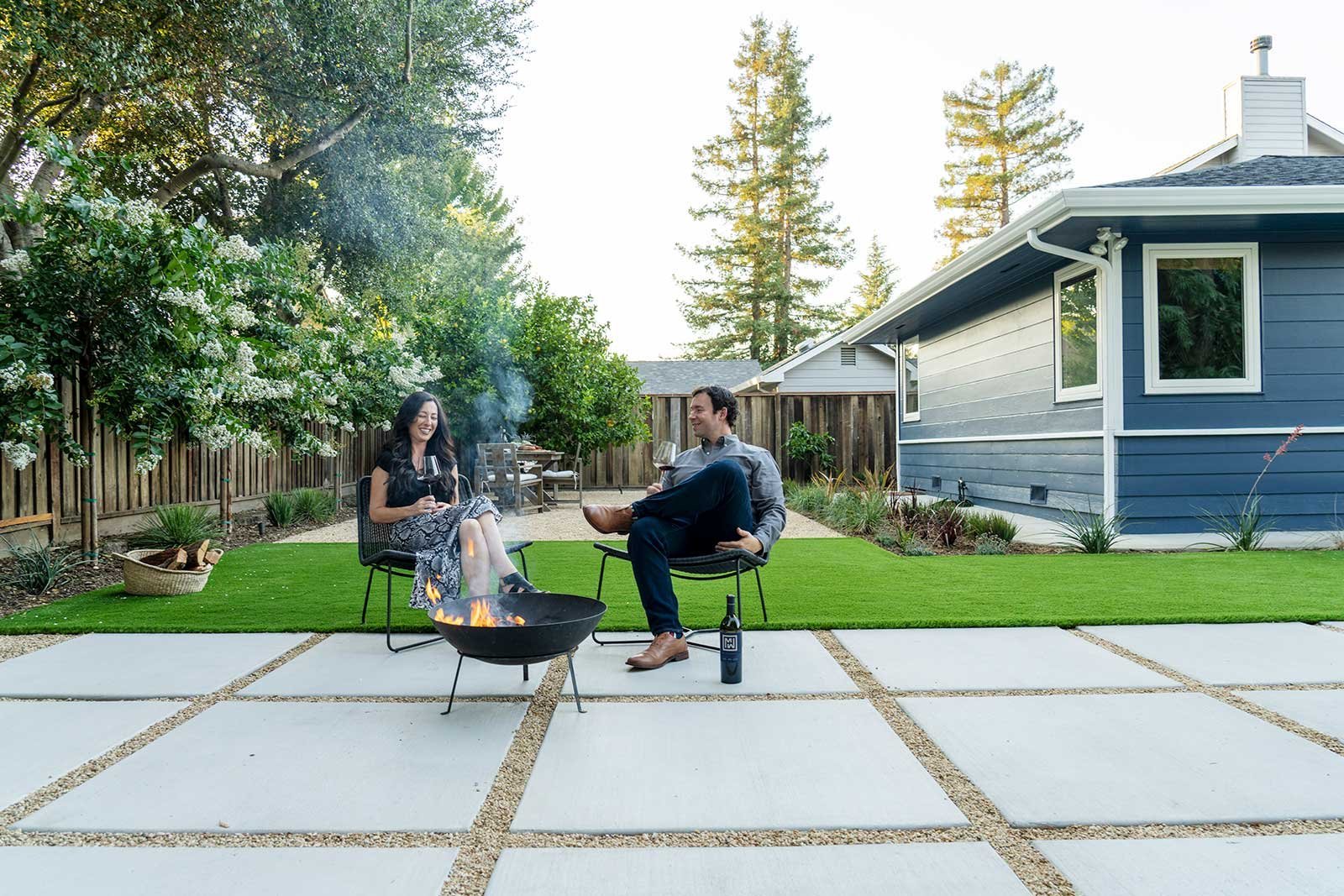 Couple enjoys wine near outdoor fire pit in Napa, CA